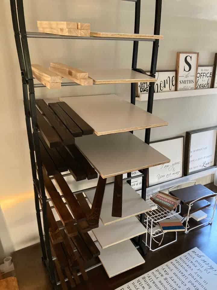 shelving with canvases and boards
