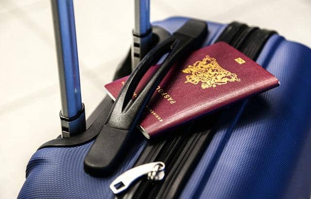 passport in a suitcase handle