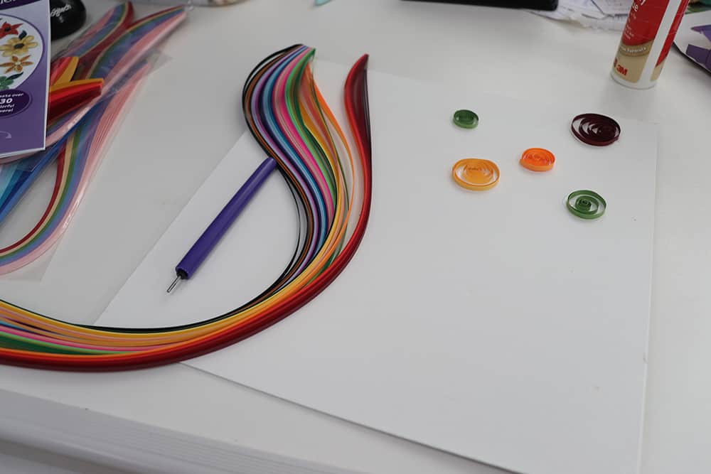 Paper quilling strips and tool.