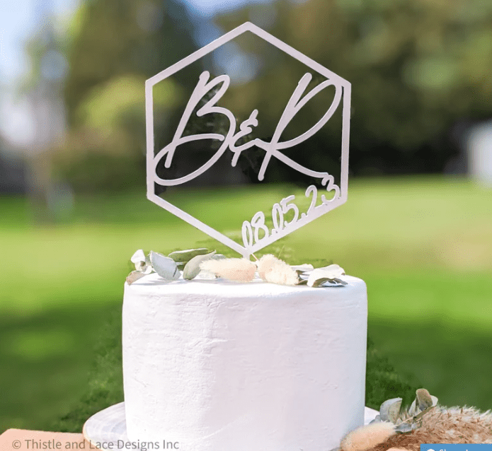 Custom cake topper by Thistle and Lace Designs