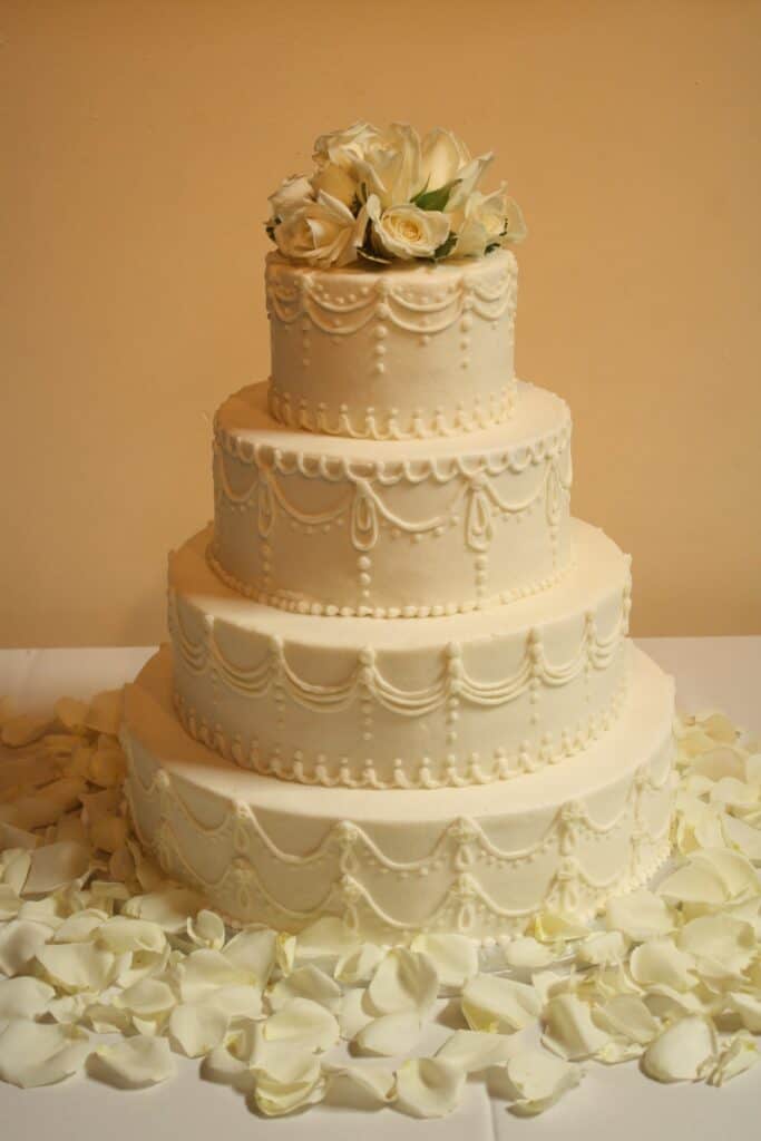 A wedding cake with buttercream piping.