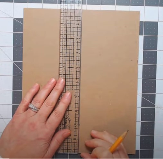 how to make a bookbinding punching cradle or trough: locate the center of the board