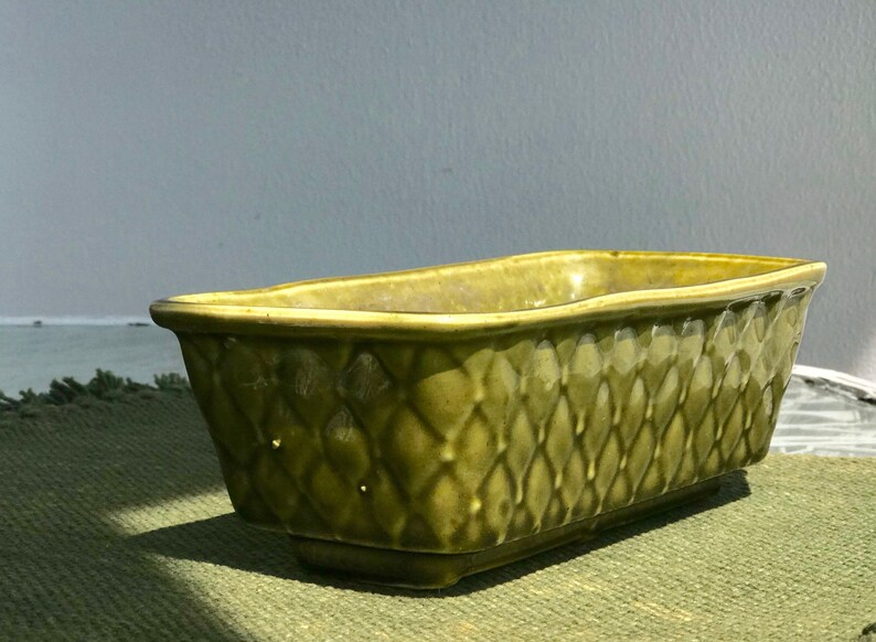 vintage ceramic planter pot with basket texture