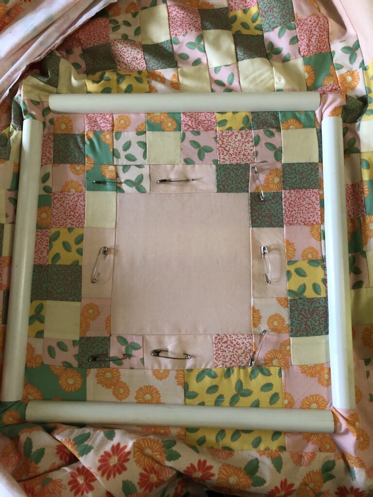Quilt in a small quilting frame