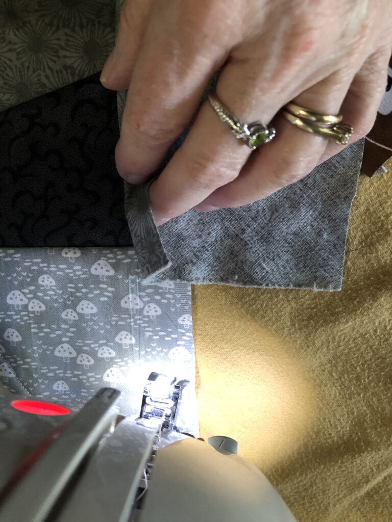 sewing up to a line where three pieces of fabric meet