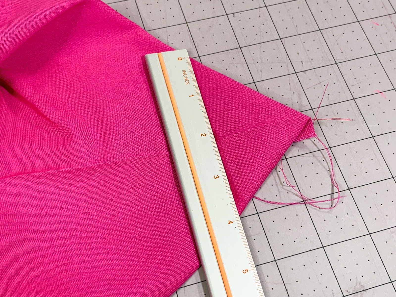 Corner of the lining fabric marked to trim