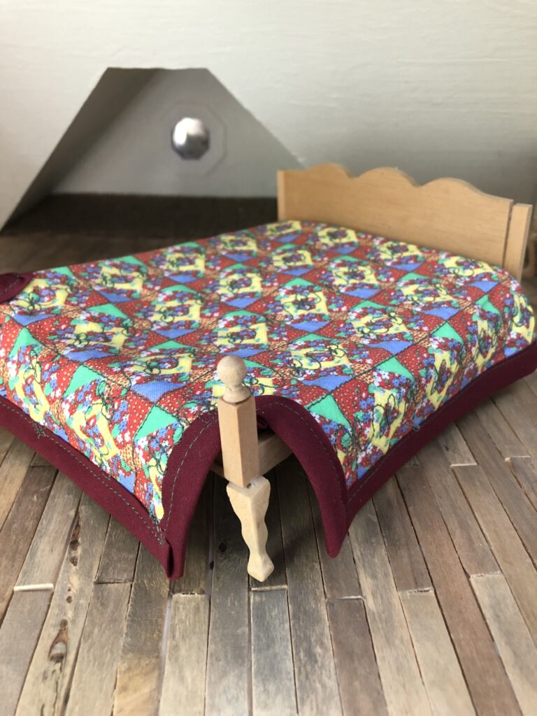 dollhouse bed with mini quilt