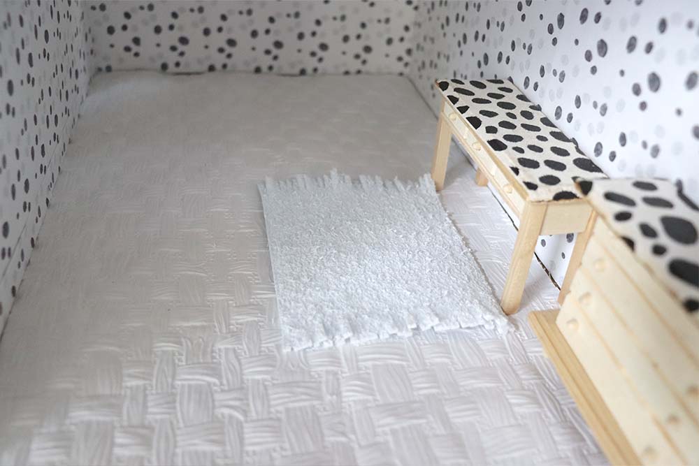 fringed edge craft foam dollhouse rug in the room