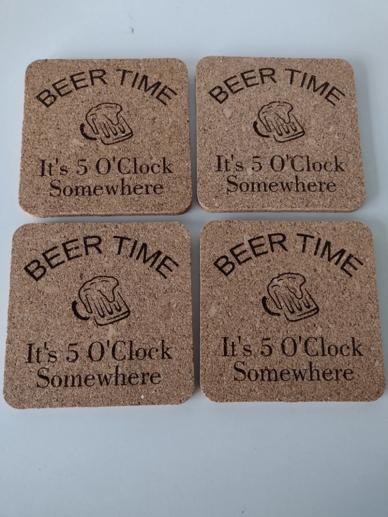 coaster with "beer time it's 5 o'clock somewhere" written on them