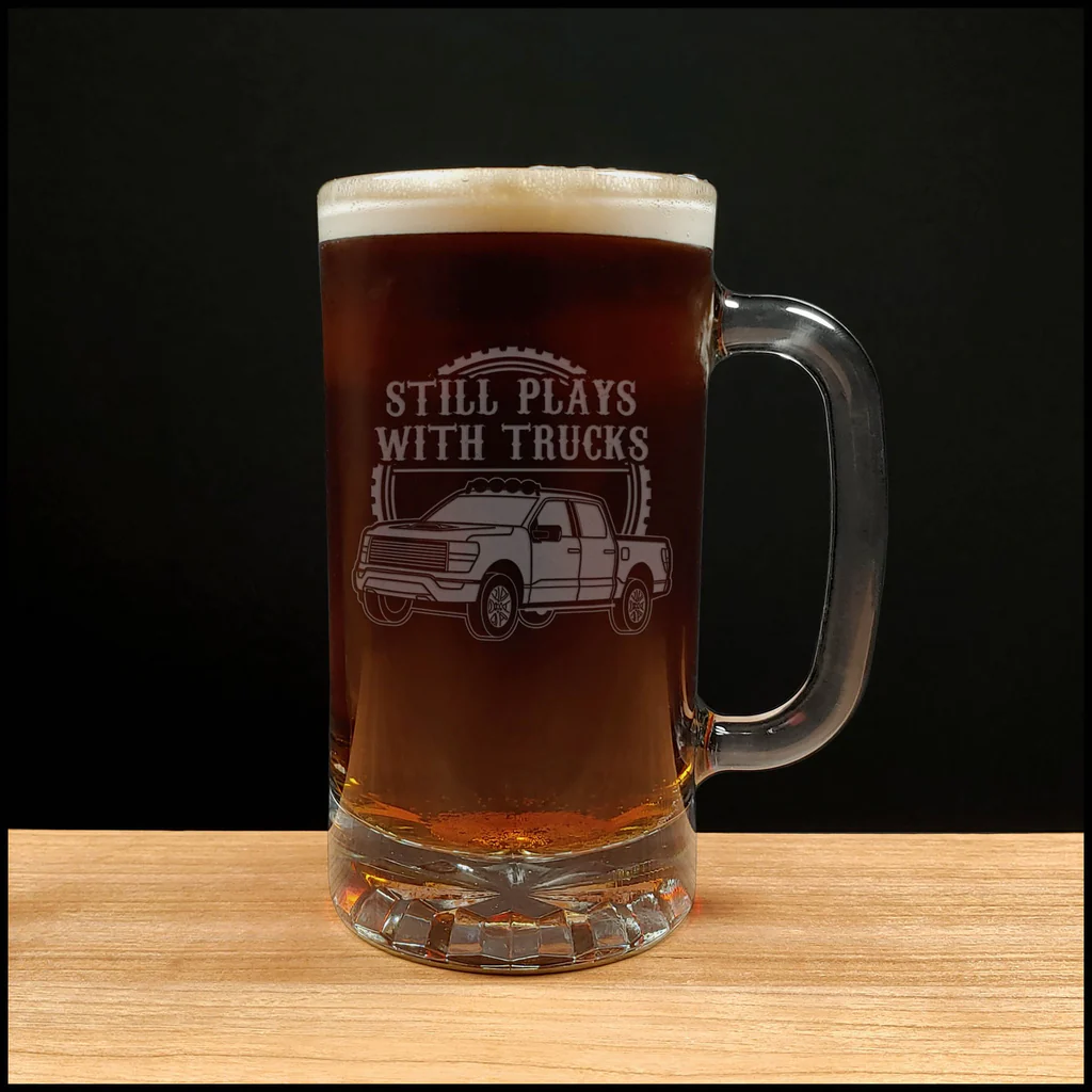 beer mug that has still plays with trucks etched into it