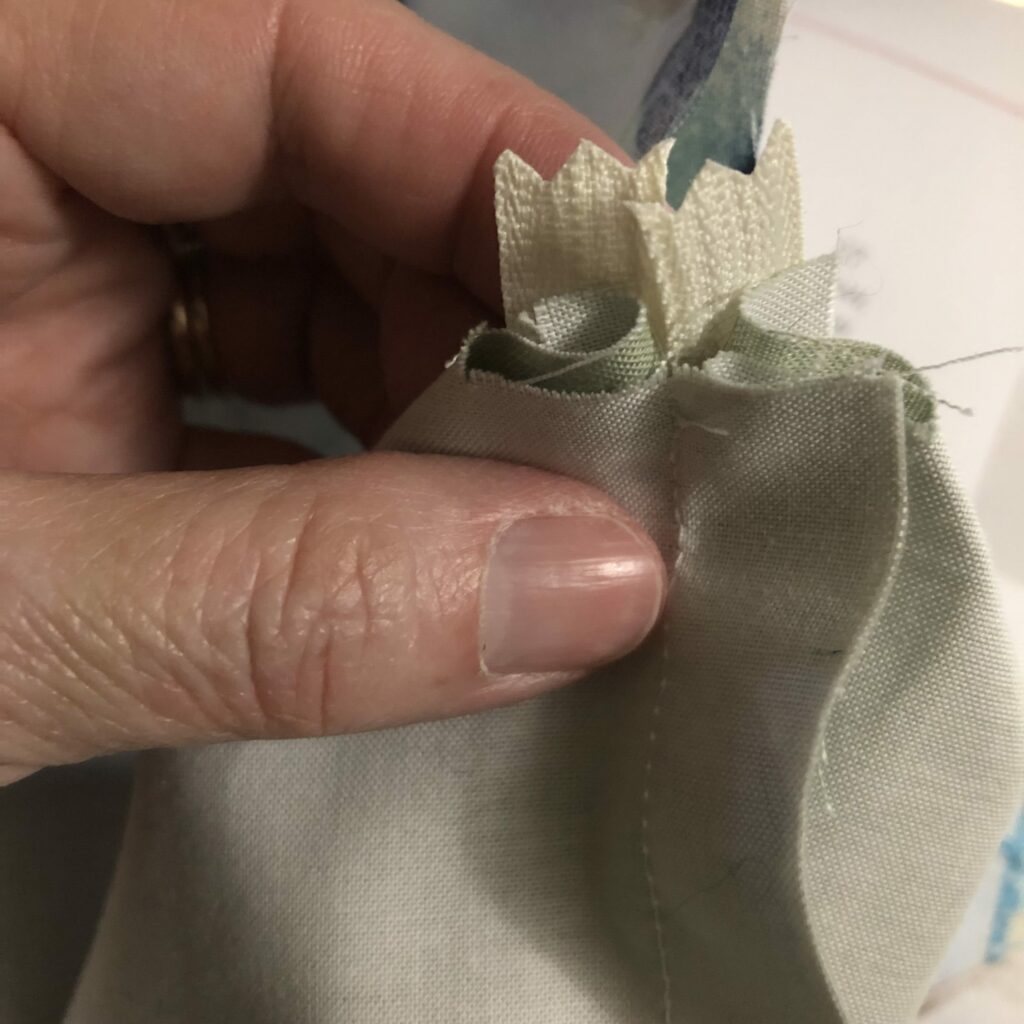 fold the edges together on the notched opening