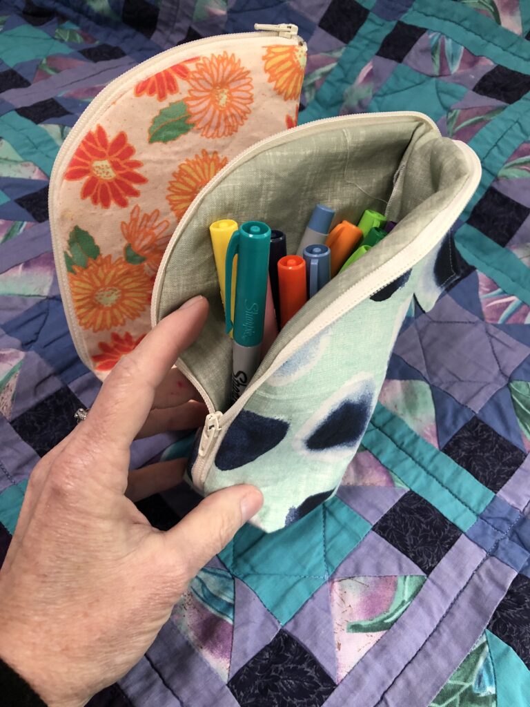 Pencil pouches with pens in them