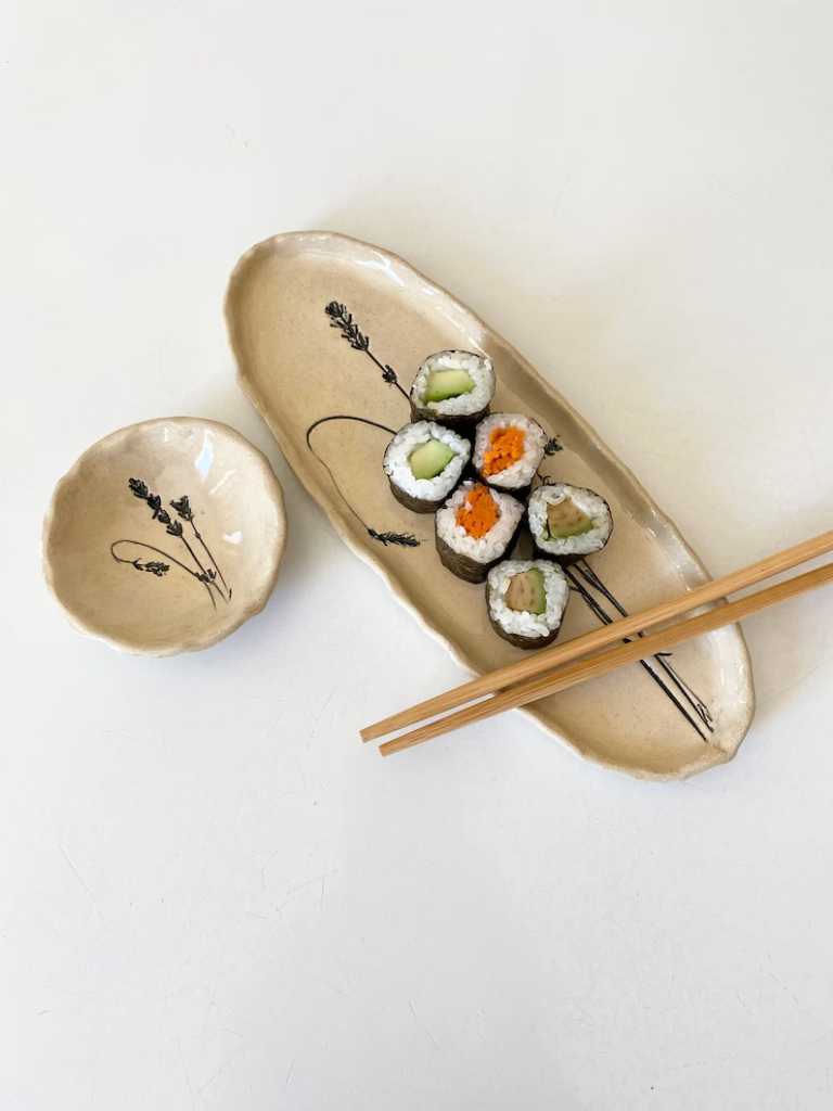 sushi board and bowl with chopsticks