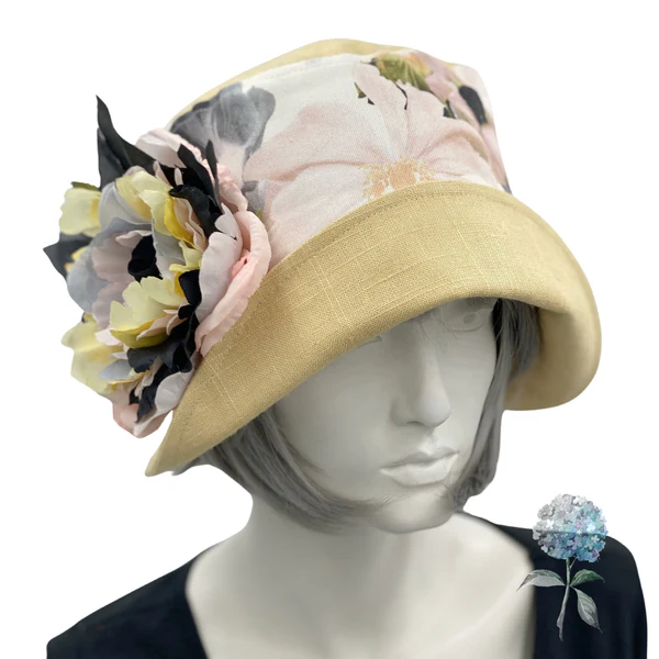 beige hat with a large flower
